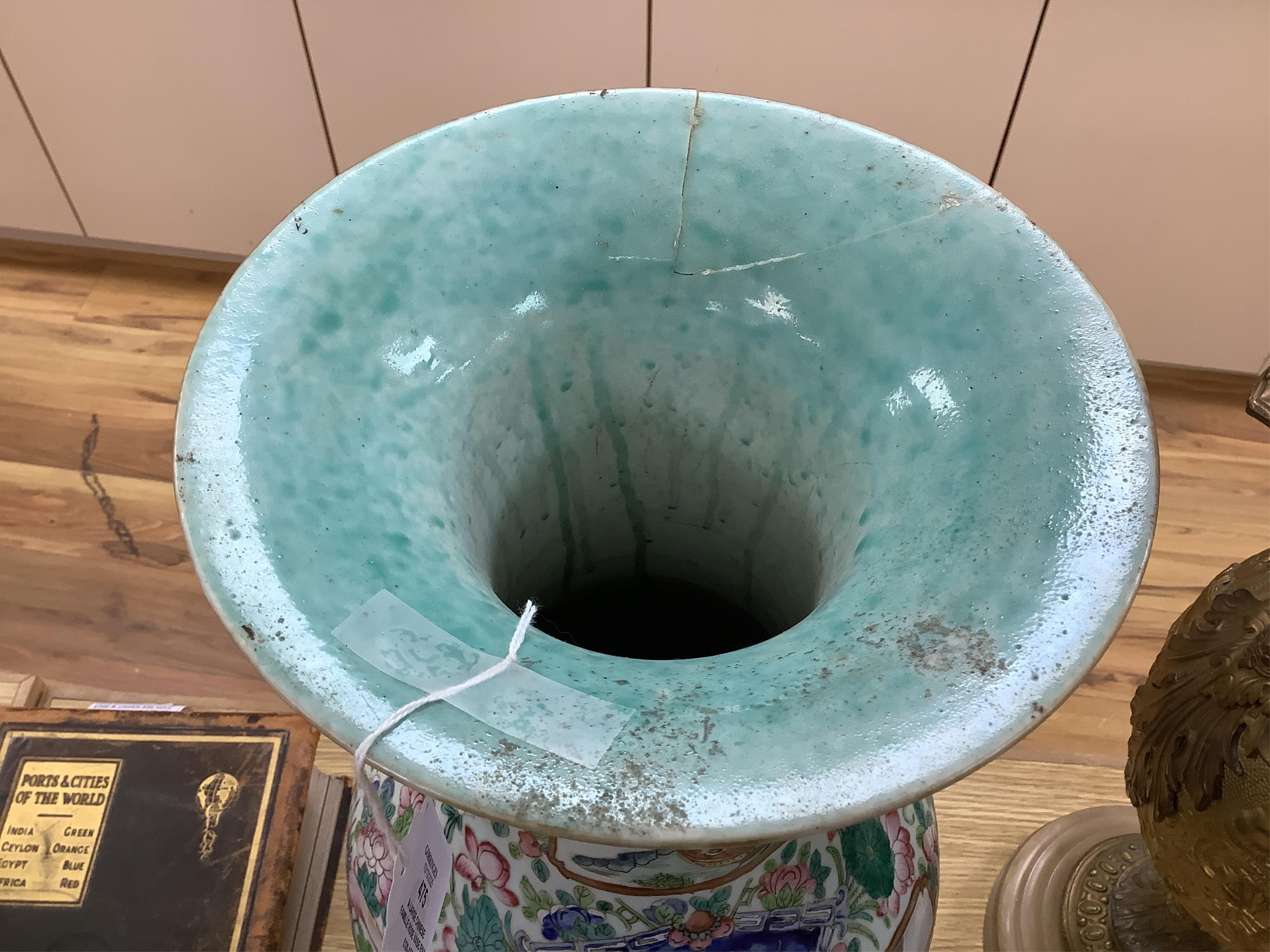 A large Chinese famille rose vase enamelled with figures and flowers, 59cm high (damaged and repaired)